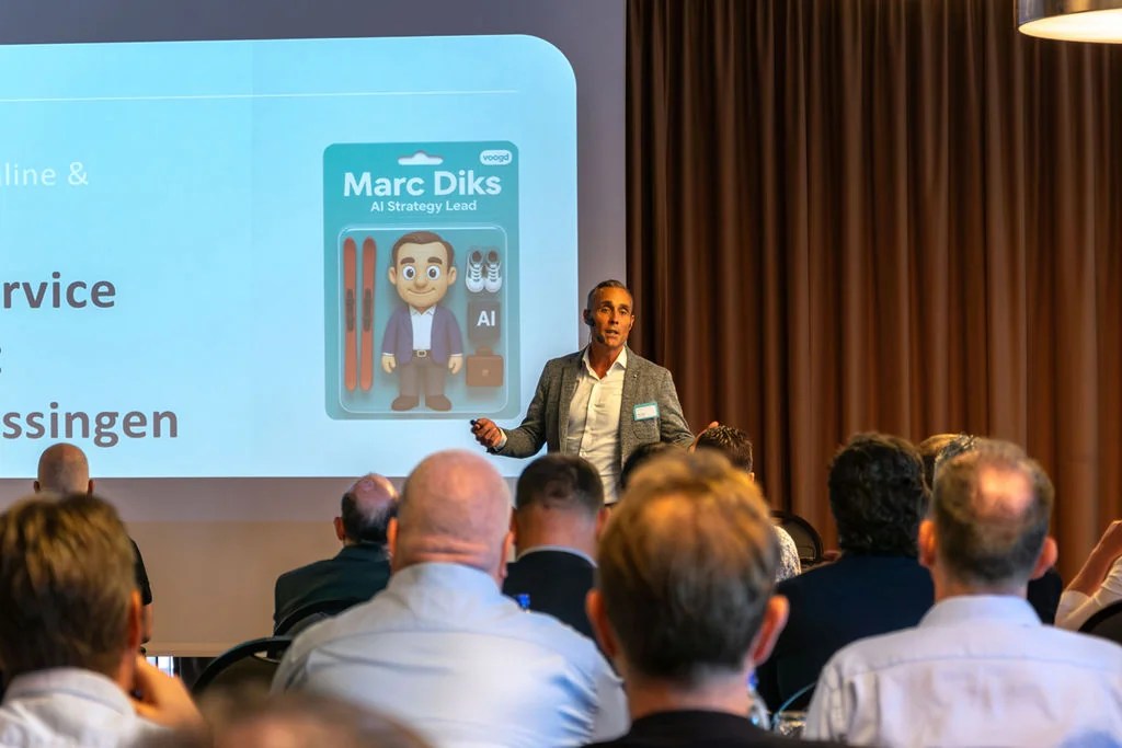 Marc Diks speaking on stage at a business event